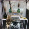 Mesa auxiliar de ambientación y decoración temática para recepciones de eventos.